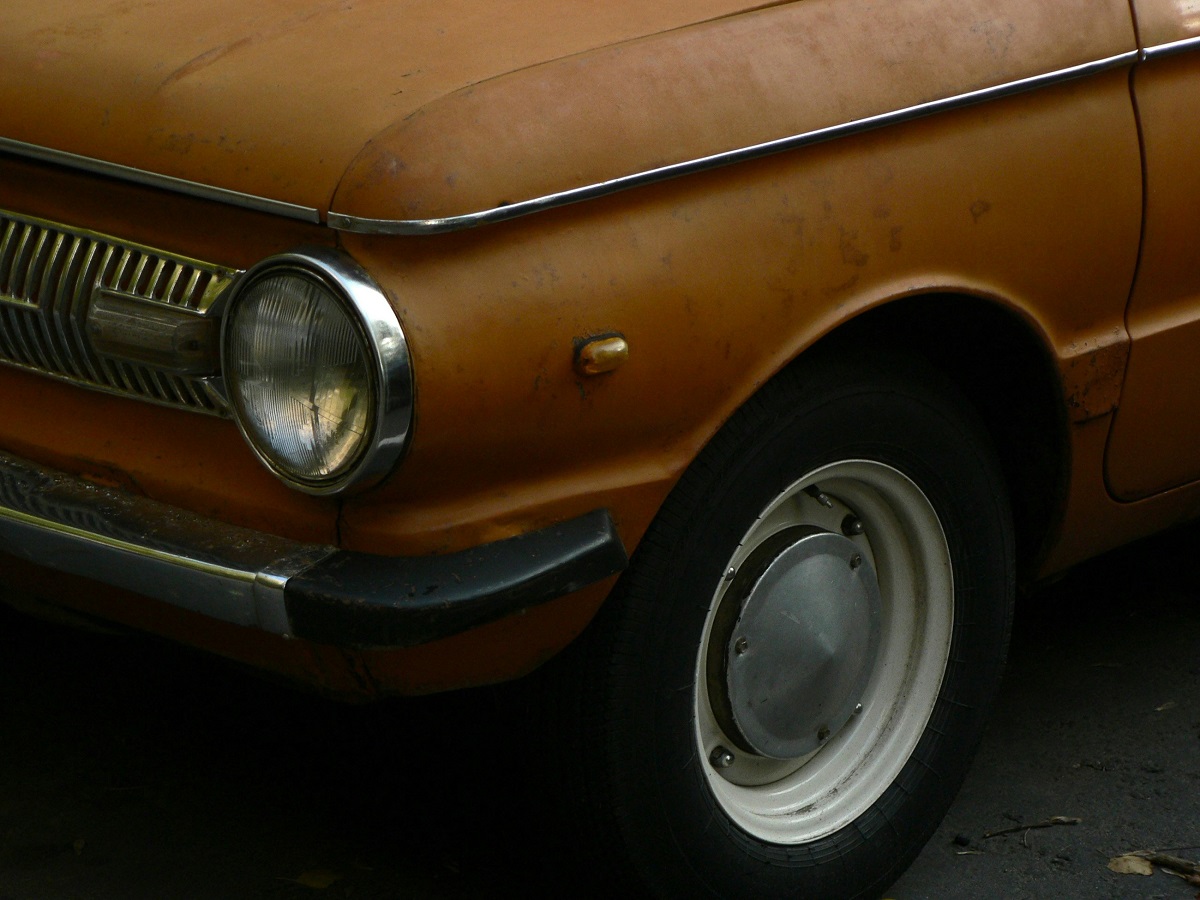 vintage car with faded orange paint